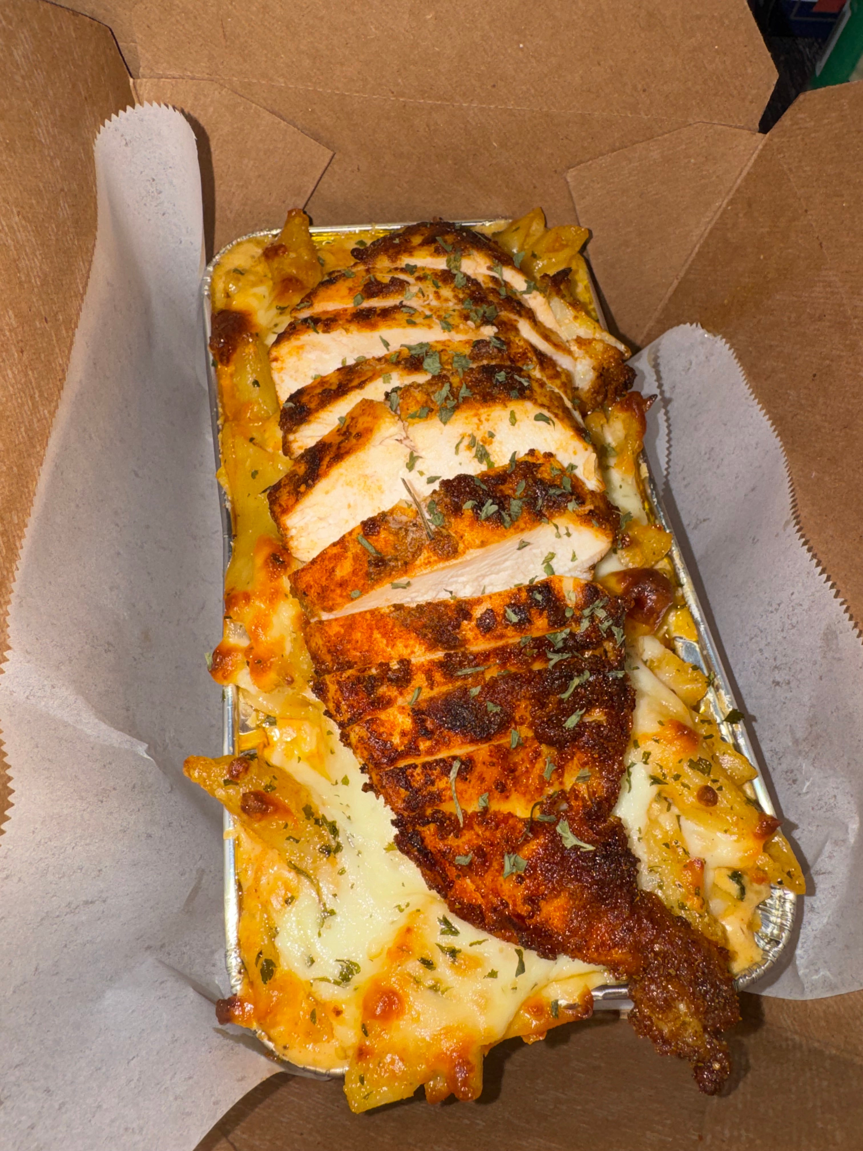 Three cheese Cajun Alfredo topped with chicken